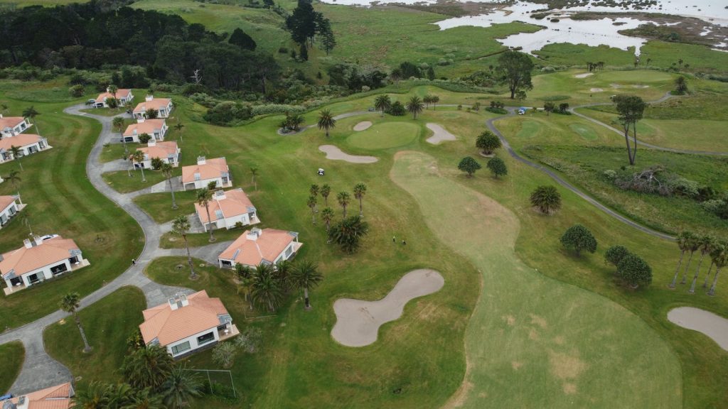 Beautiful aerial view of golf course and residential villas in Auckland, New Zealand.