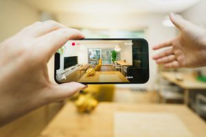 A person taking a picture of a kitchen